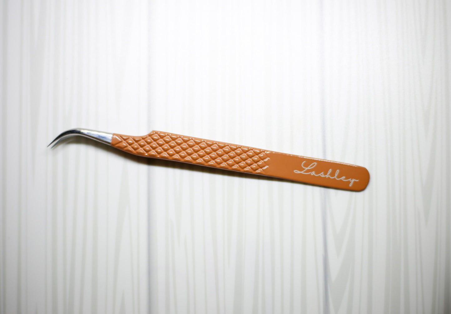 In the nude: J tweezer